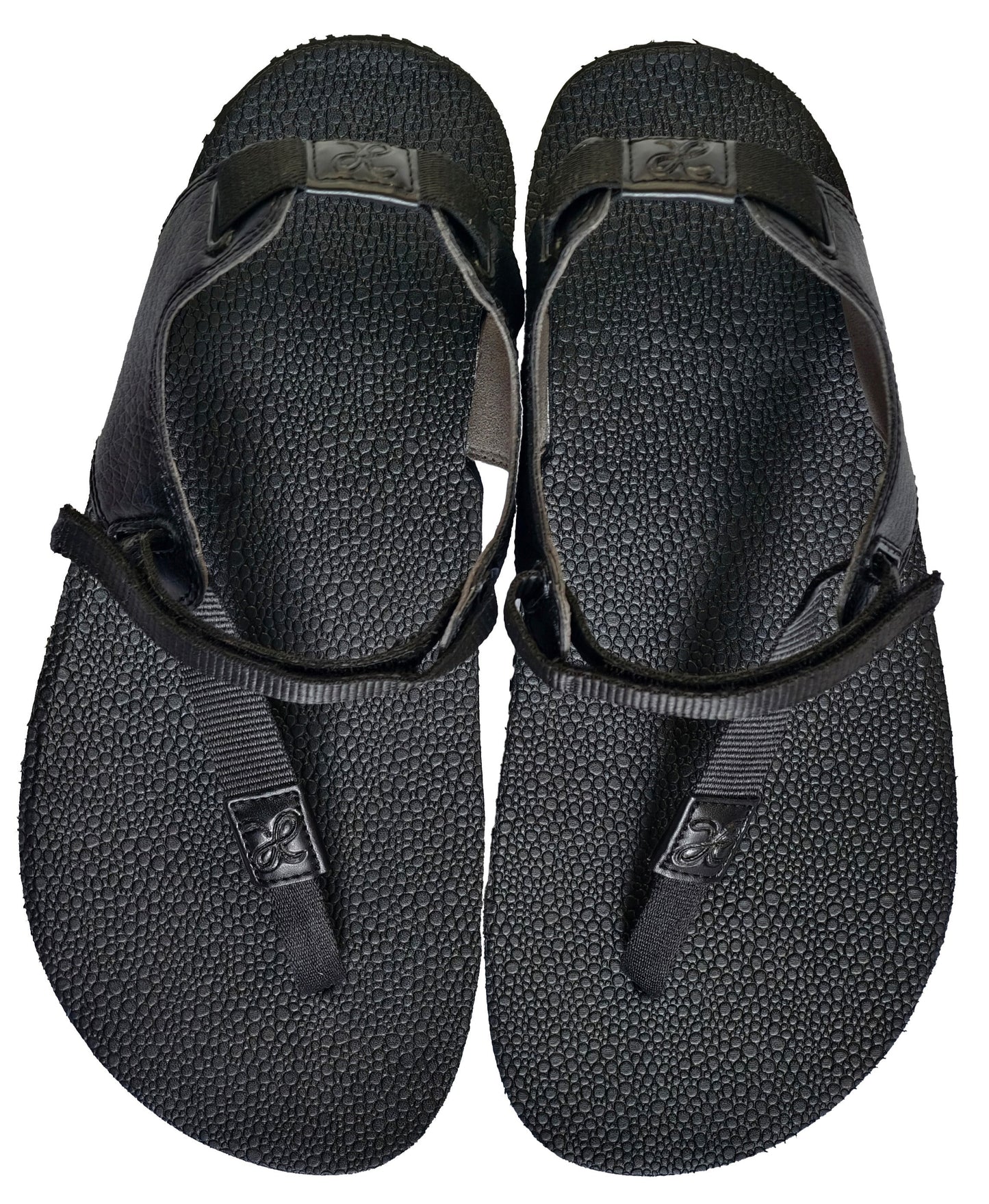 Pair of black barefoot minimalist running sandals waterproof and zero heel for posture correction and toe landing