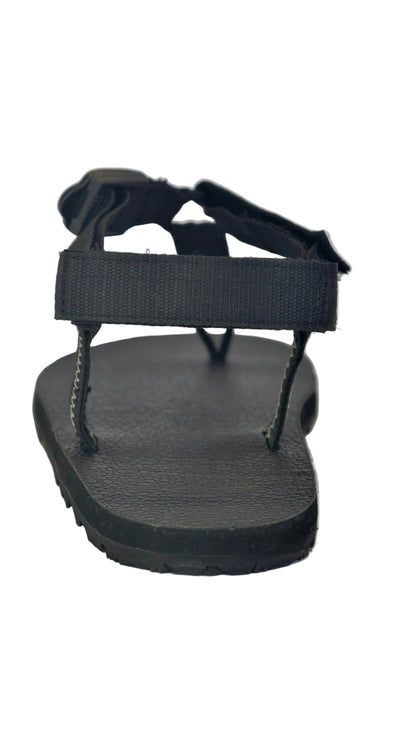 Hell or back view showing grounded talons and adjustable strap on minimalist sandals