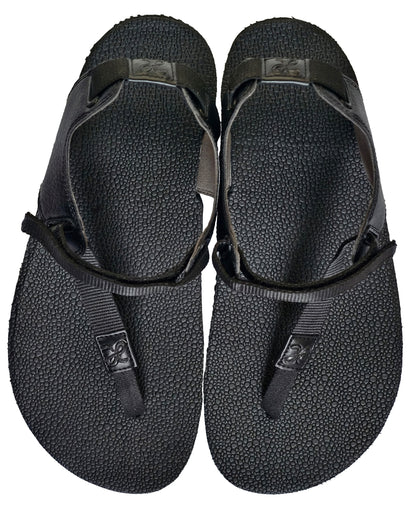 Pair of black barefoot minimalist running sandals waterproof and zero heel for posture correction and toe landing