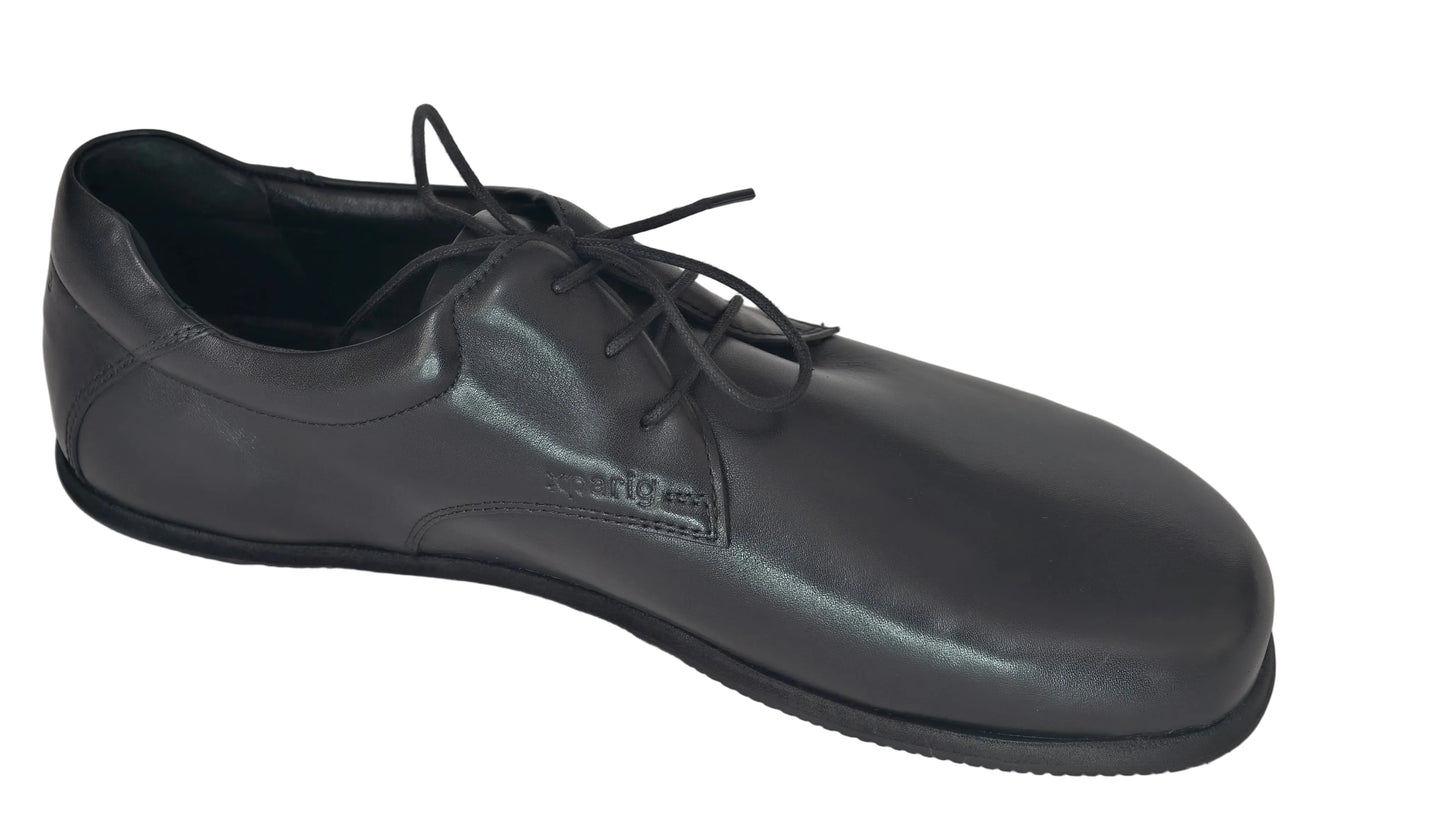 Black leather shoe on a white background