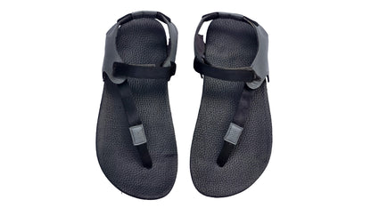 Pair of black sandals with straps on a white background